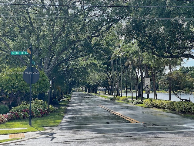 1732 SW 103rd Ln, Davie, FL 33324 - view of asphalt street with traffic signs and view of scattered trees