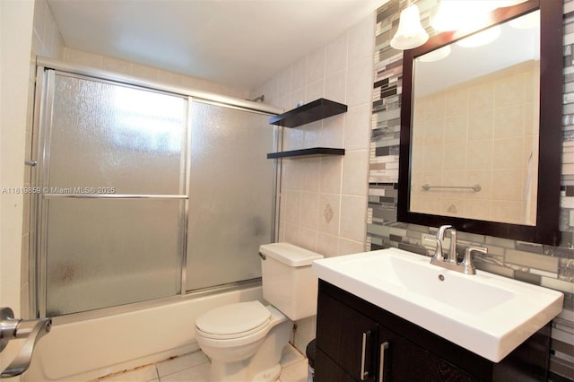 6503 Winfield Blvd Unit 111Ad, Margate, FL 33063 - bathroom featuring vanity, enclosed tub / shower combo, tile patterned flooring, tile walls, and tasteful backsplash