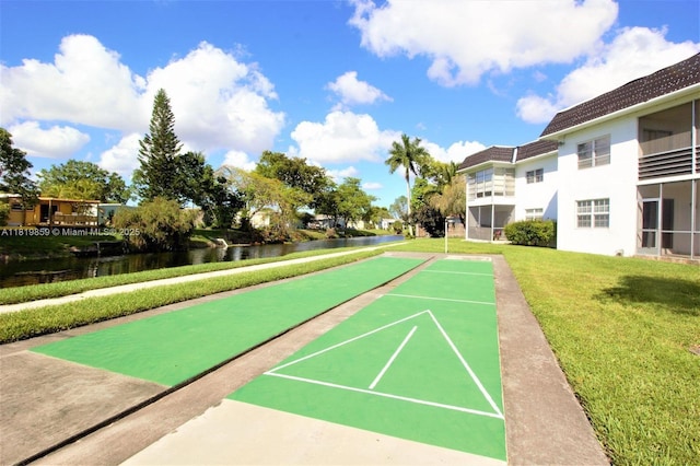 6503 Winfield Blvd Unit 111Ad, Margate, FL 33063 - view of home's community with shuffleboard, a water view, and a lawn
