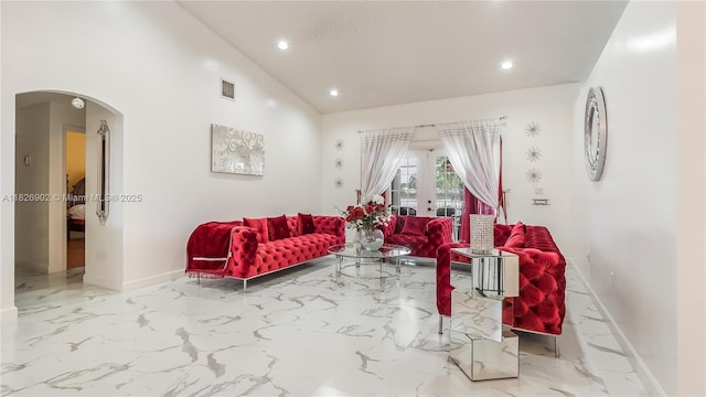 1720 SW 137th Way, Miramar, FL 33027 - living area featuring arched walkways, marble tiled flooring, recessed lighting, french doors, and lofted ceiling