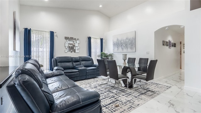 1720 SW 137th Way, Miramar, FL 33027 - living room featuring arched walkways, marble look tile flooring, high vaulted ceiling, and recessed lighting