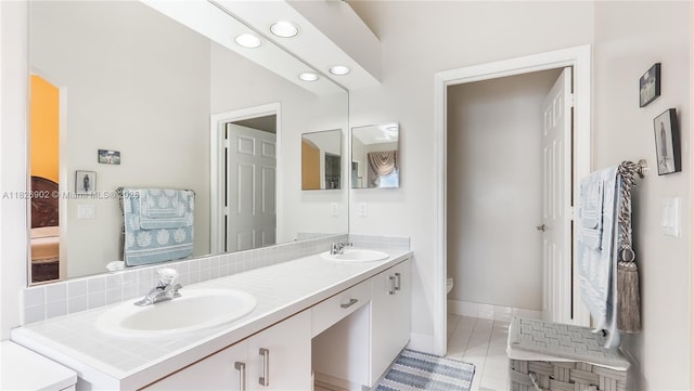 1720 SW 137th Way, Miramar, FL 33027 - full bathroom featuring double vanity, tile patterned flooring, recessed lighting, and connected bathroom