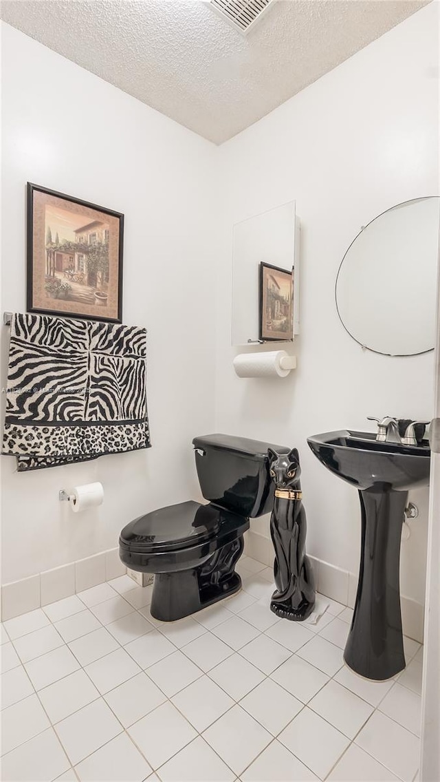1720 SW 137th Way, Miramar, FL 33027 - bathroom featuring tile patterned flooring and a textured ceiling