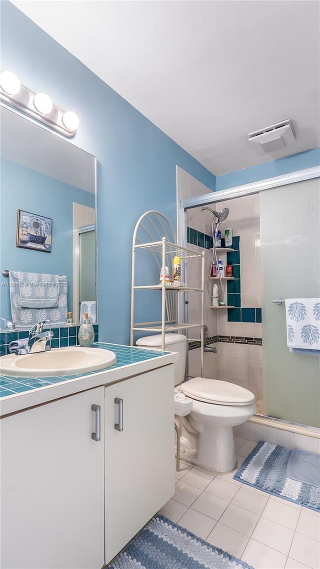 1720 SW 137th Way, Miramar, FL 33027 - bathroom featuring tile patterned floors, vanity, and a stall shower
