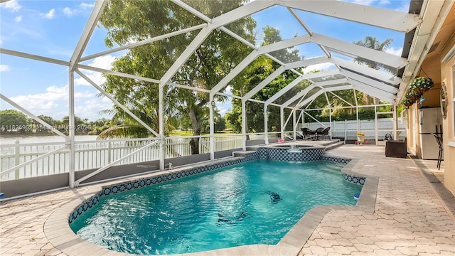 1720 SW 137th Way, Miramar, FL 33027 - view of pool with an in-ground hot tub, a fenced backyard, a patio area, a water view, and a lanai