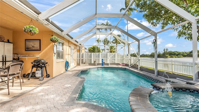 1720 SW 137th Way, Miramar, FL 33027 - view of pool featuring a patio area, a fenced backyard, grilling area, a lanai, and a pool with connected hot tub