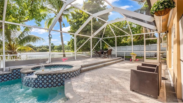 1720 SW 137th Way, Miramar, FL 33027 - view of pool featuring a fenced backyard, a patio area, glass enclosure, and a pool with connected hot tub