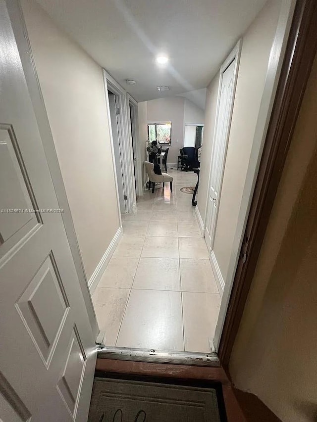 15405 N Miami Lakeway N Unit 307, Miami Lakes, FL 33014 - corridor featuring light tile patterned floors and baseboards