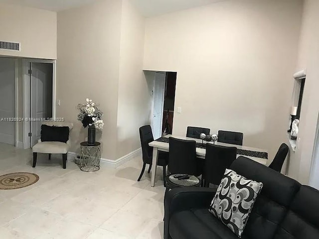 15405 N Miami Lakeway N Unit 307, Miami Lakes, FL 33014 - dining room with a towering ceiling and baseboards