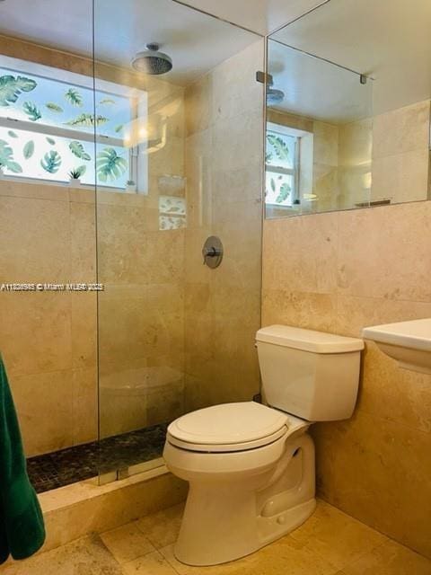 1698 Jefferson Ave Unit 9, Miami Beach, FL 33139 - bathroom with tile walls, a tile shower, and tile patterned flooring