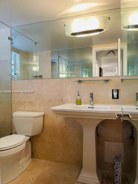 1698 Jefferson Ave Unit 9, Miami Beach, FL 33139 - bathroom featuring tile walls and decorative backsplash