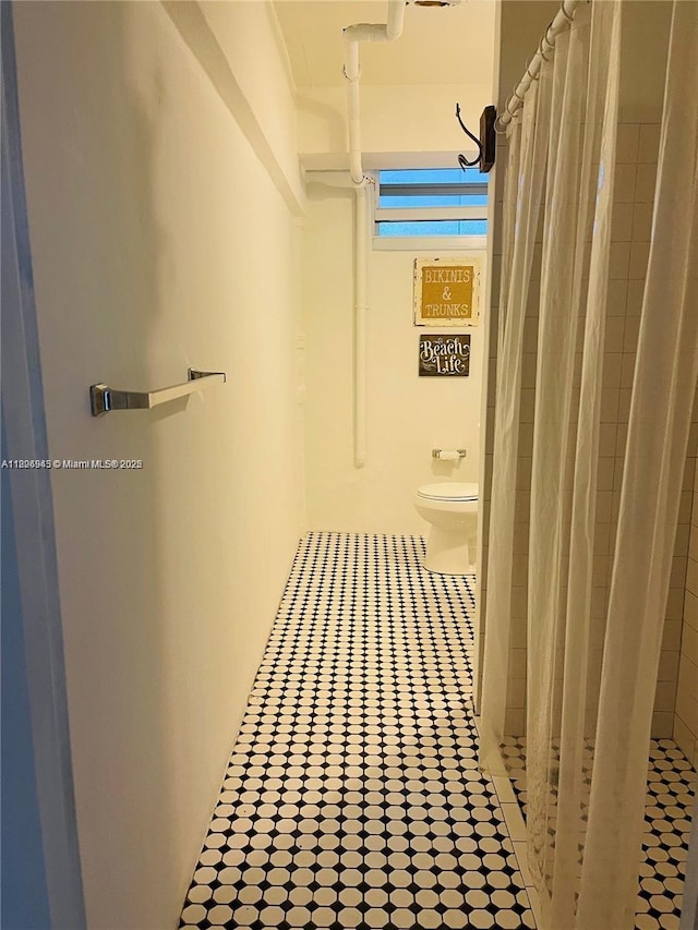 1698 Jefferson Ave Unit 9, Miami Beach, FL 33139 - bathroom featuring a shower with curtain and tile patterned flooring