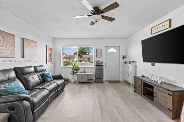 7307 SW 8th St, North Lauderdale, FL 33068 - living room with light wood-style flooring, a ceiling fan, and a textured ceiling
