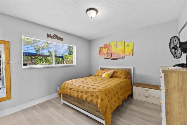 7307 SW 8th St, North Lauderdale, FL 33068 - bedroom featuring wood finished floors and a textured ceiling