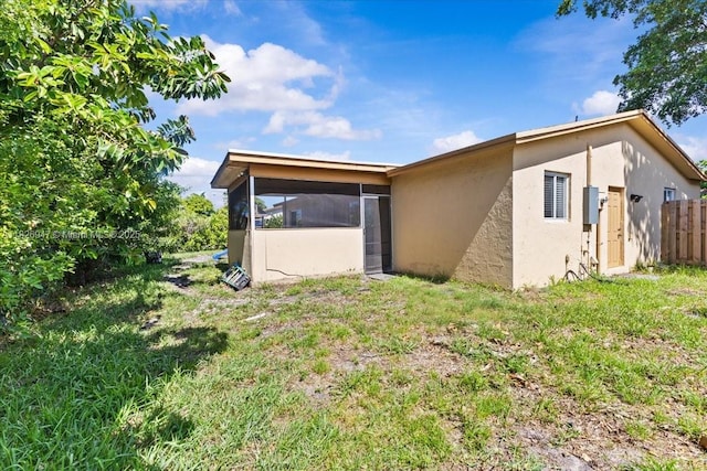 7307 SW 8th St, North Lauderdale, FL 33068 - back of house featuring a sunroom and stucco siding