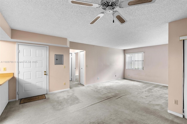 9852 NW 3rd Ct Unit 1, Plantation, FL 33324 - unfurnished living room with ceiling fan, carpet flooring, a textured ceiling, and electric panel