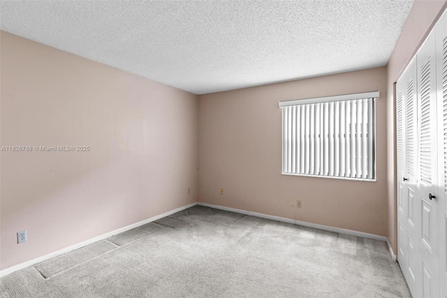 9852 NW 3rd Ct Unit 1, Plantation, FL 33324 - unfurnished bedroom featuring a closet, carpet floors, and a textured ceiling
