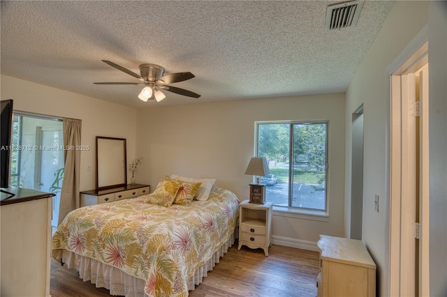6286 Chasewood Dr Unit G, Jupiter, FL 33458 - bedroom with light wood-style floors, a textured ceiling, and ceiling fan