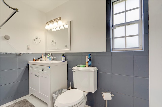 13645 NW 3rd Ave, North Miami, FL 33168 - bathroom with tile walls, healthy amount of natural light, vanity, and wainscoting