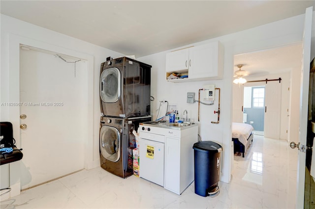 13645 NW 3rd Ave, North Miami, FL 33168 - washroom with stacked washer / dryer, cabinet space, and light marble finish flooring