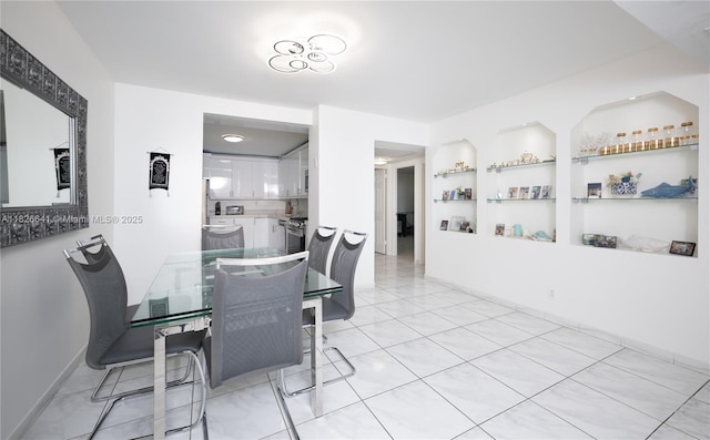 2030 S Ocean Dr Unit 227, Hallandale Beach, FL 33009 - dining space featuring built in shelves and light tile patterned flooring