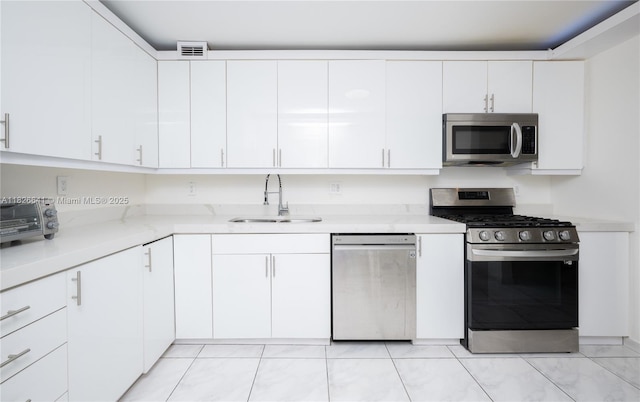 2030 S Ocean Dr Unit 227, Hallandale Beach, FL 33009 - kitchen featuring stainless steel appliances and white cabinets