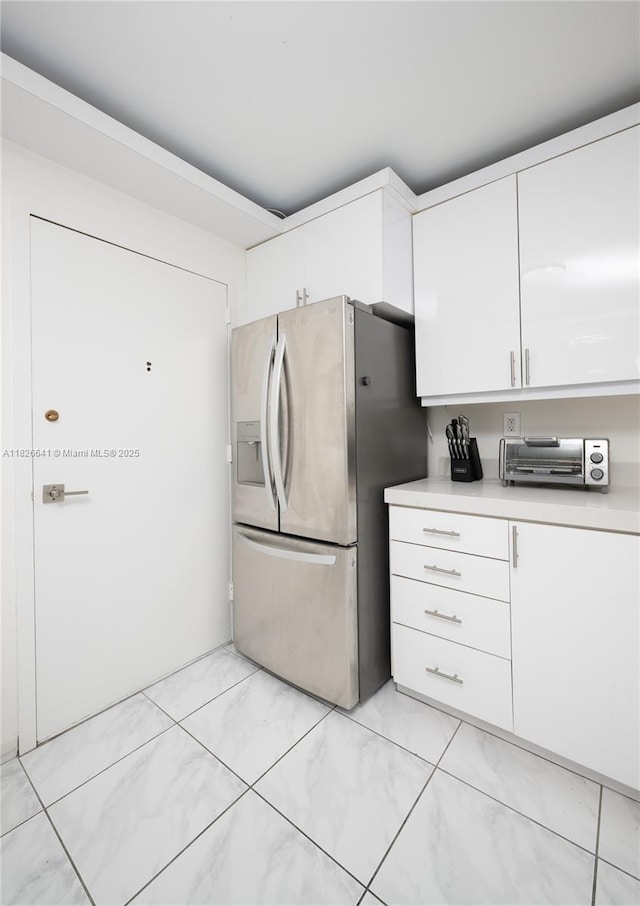 2030 S Ocean Dr Unit 227, Hallandale Beach, FL 33009 - kitchen with stainless steel fridge, light countertops, and white cabinetry