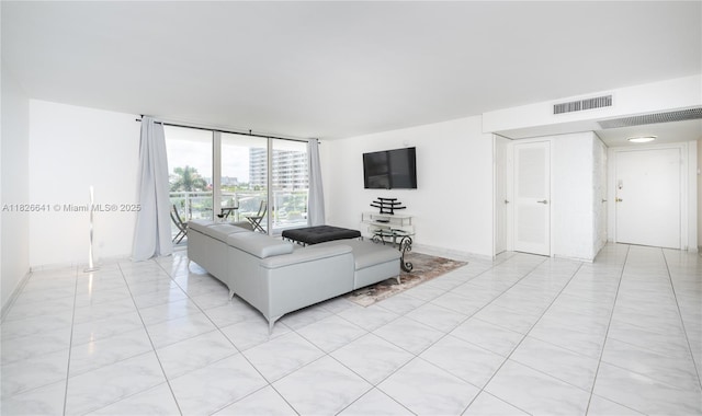 2030 S Ocean Dr Unit 227, Hallandale Beach, FL 33009 - living room with a wall of windows and baseboards