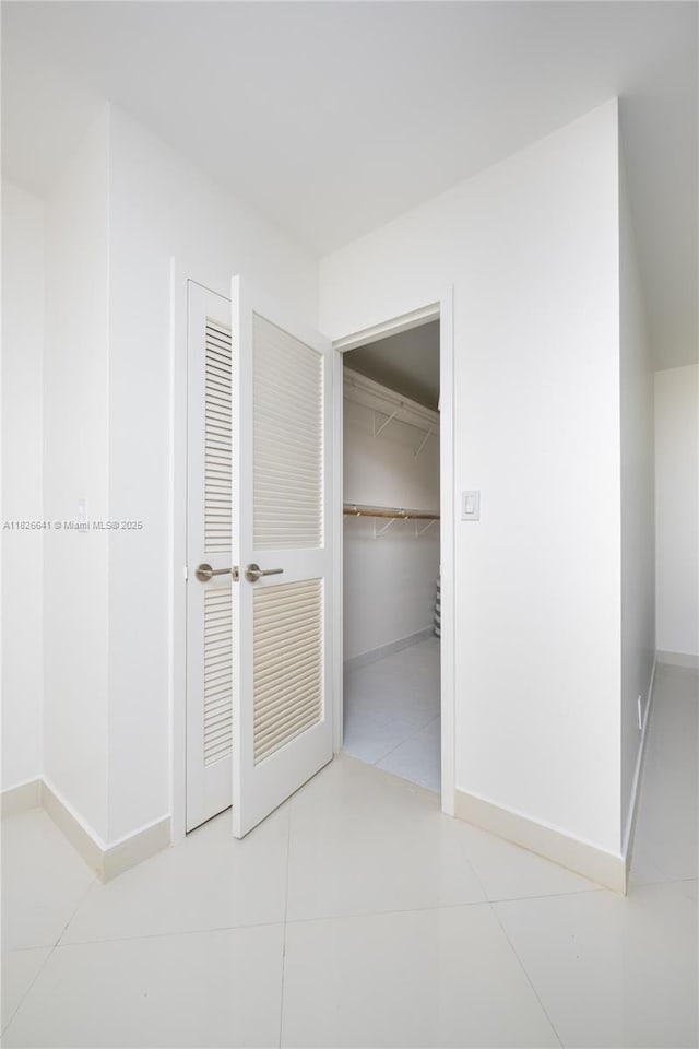 2030 S Ocean Dr Unit 227, Hallandale Beach, FL 33009 - hall with baseboards and tile patterned flooring