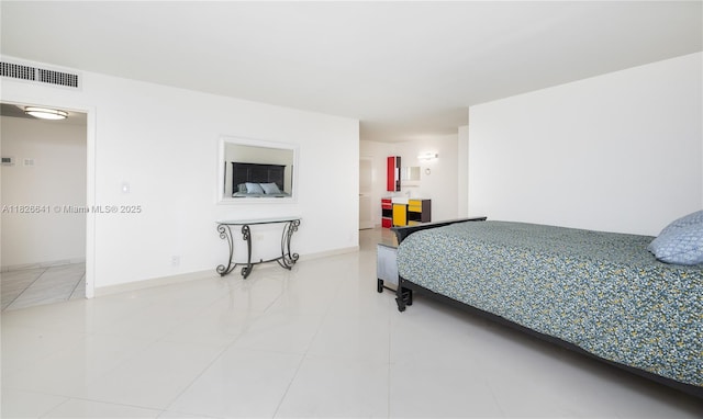 2030 S Ocean Dr Unit 227, Hallandale Beach, FL 33009 - bedroom featuring tile patterned flooring and baseboards