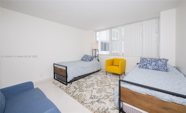 2030 S Ocean Dr Unit 227, Hallandale Beach, FL 33009 - tiled bedroom featuring baseboards