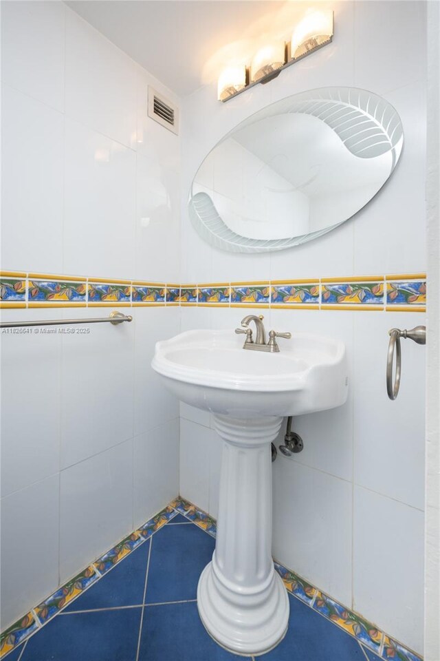 2030 S Ocean Dr Unit 227, Hallandale Beach, FL 33009 - bathroom featuring tile walls and tile patterned flooring