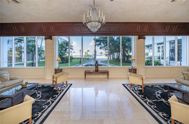 2030 S Ocean Dr Unit 227, Hallandale Beach, FL 33009 - sunroom / solarium featuring healthy amount of natural light and a chandelier