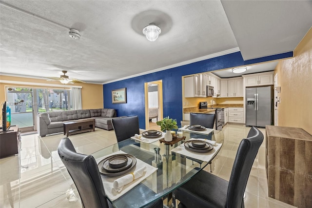 1428 SE 4th Ave Unit 146, Deerfield Beach, FL 33441 - dining space featuring a ceiling fan, a textured ceiling, light tile patterned floors, and crown molding