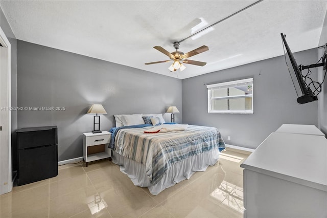 1428 SE 4th Ave Unit 146, Deerfield Beach, FL 33441 - bedroom featuring a ceiling fan, a textured ceiling, and light tile patterned floors