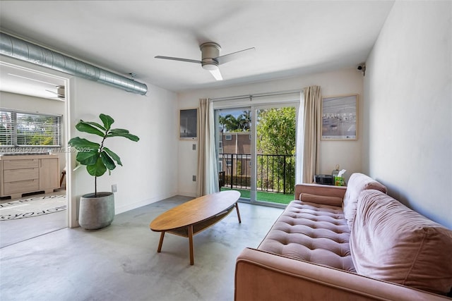 1900 Meridian Ave Unit 204, Miami Beach, FL 33139 - living room featuring ceiling fan and concrete flooring