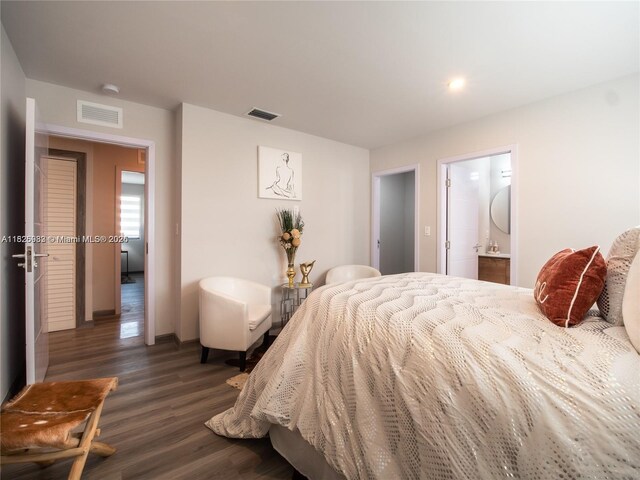 926 NW 10th St Unit 2, Florida City, FL 33034 - bedroom featuring dark wood-style floors, connected bathroom, and recessed lighting