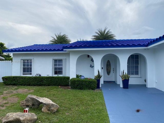 7322 SW 134th Pl, Miami, FL 33183 - view of front of house with a front yard and stucco siding