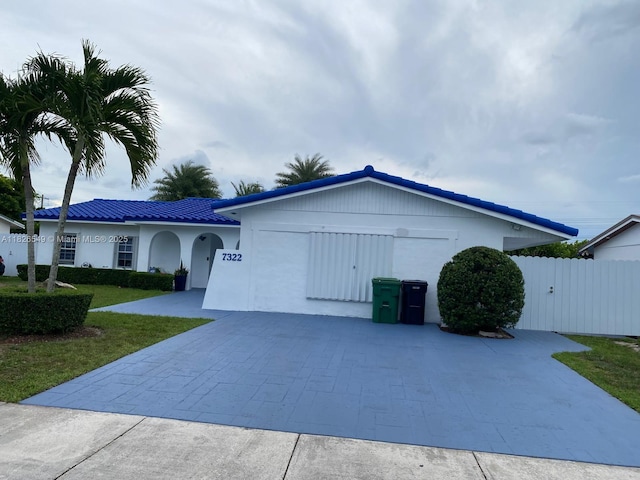 7322 SW 134th Pl, Miami, FL 33183 - ranch-style home with an attached garage, decorative driveway, stucco siding, and a tiled roof
