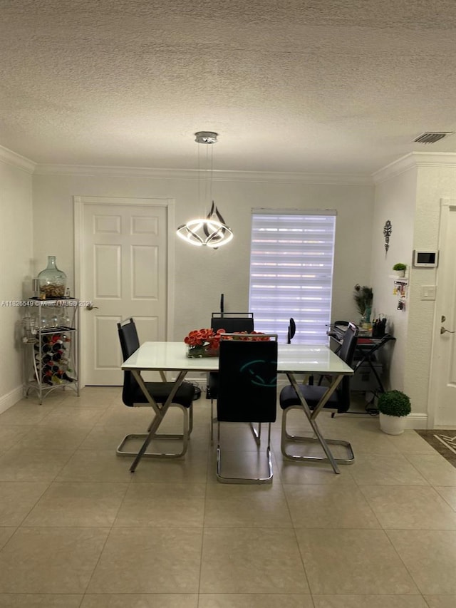 7322 SW 134th Pl, Miami, FL 33183 - dining area featuring crown molding, a textured ceiling, and light tile patterned flooring