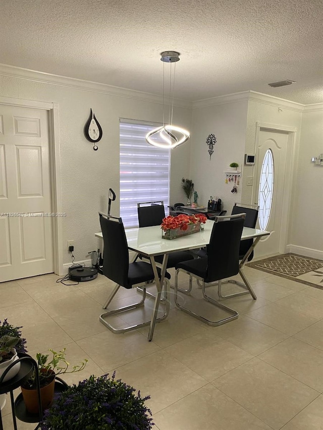 7322 SW 134th Pl, Miami, FL 33183 - dining space with crown molding, a textured ceiling, light tile patterned floors, and healthy amount of natural light