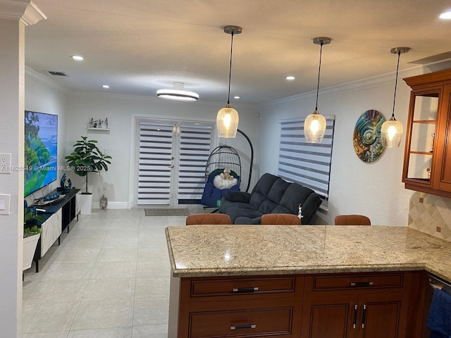 7322 SW 134th Pl, Miami, FL 33183 - kitchen with a peninsula, hanging light fixtures, light stone countertops, ornamental molding, and recessed lighting