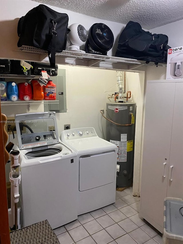 7322 SW 134th Pl, Miami, FL 33183 - laundry area with gas water heater, separate washer and dryer, light tile patterned flooring, and a textured ceiling