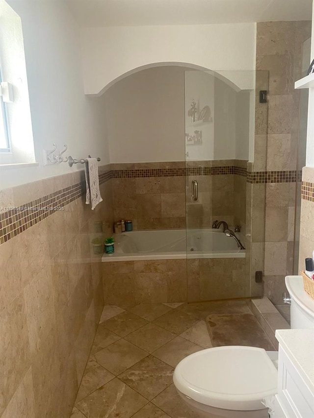 7322 SW 134th Pl, Miami, FL 33183 - full bathroom with tile walls, a bath, a tile shower, vanity, and tile patterned flooring