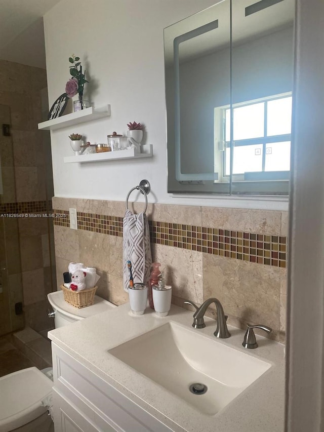 7322 SW 134th Pl, Miami, FL 33183 - full bath with a shower stall, vanity, tile walls, and decorative backsplash