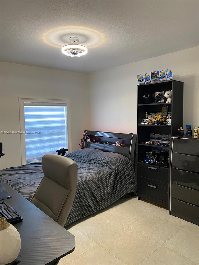 7322 SW 134th Pl, Miami, FL 33183 - bedroom with light tile patterned floors and a textured ceiling