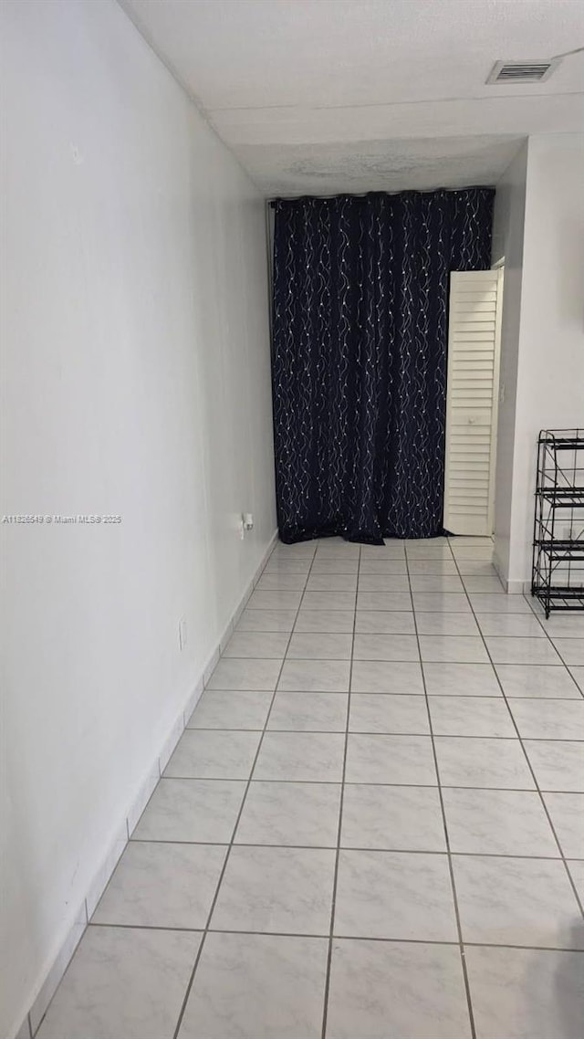 7322 SW 134th Pl, Miami, FL 33183 - empty room with light tile patterned flooring
