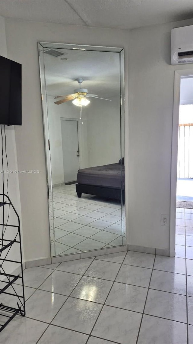 7322 SW 134th Pl, Miami, FL 33183 - hallway with an AC wall unit and light tile patterned flooring