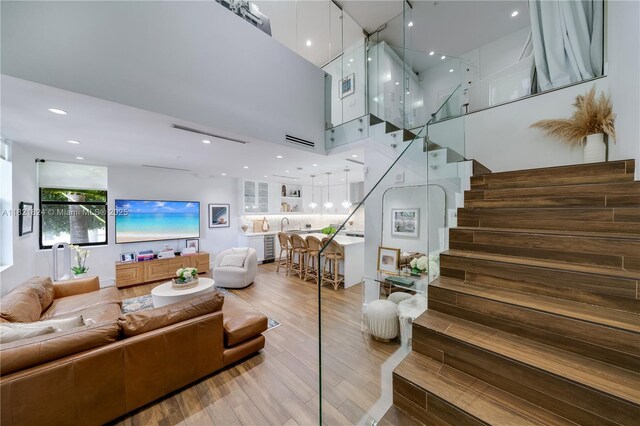 888 S Douglas Rd Unit 115, Coral Gables, FL 33134 - living area with stairway, wood finished floors, and recessed lighting