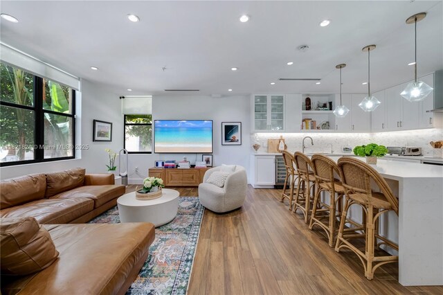 888 S Douglas Rd Unit 115, Coral Gables, FL 33134 - living area featuring light wood-style floors, recessed lighting, and wine cooler